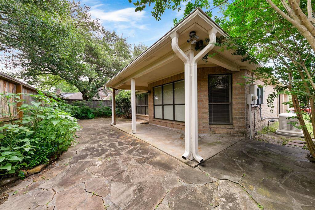 Covered patio ideal for outdoor relaxation and entertaining, offering protection from the elements.