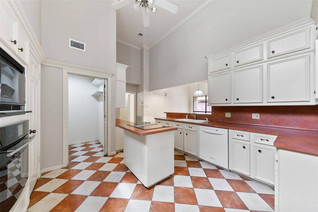 Open kitchen layout creates a natural flow to the living and dining areas—ideal for cooking, gathering, and entertaining