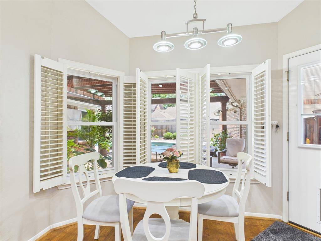 you'll love this cheerful breakfast room with pool view.