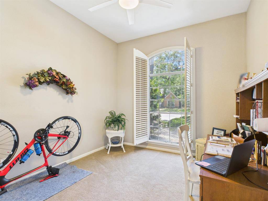 2nd bedroom with beautiful view of front yard, currently used as a study.