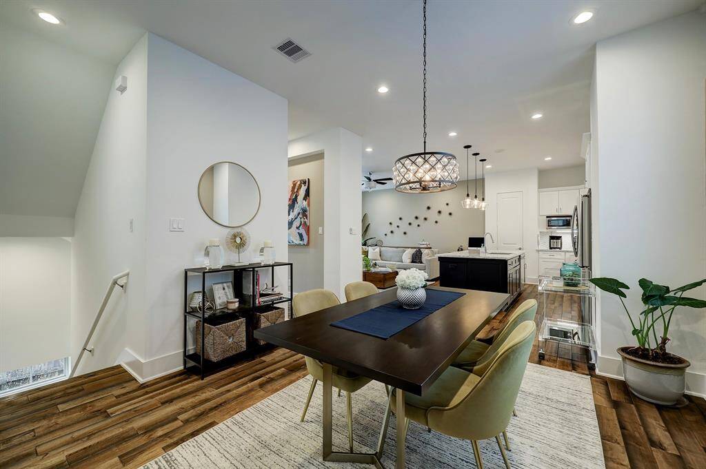 Dining room from the landing; powder bath is conveniently located off the hallway.