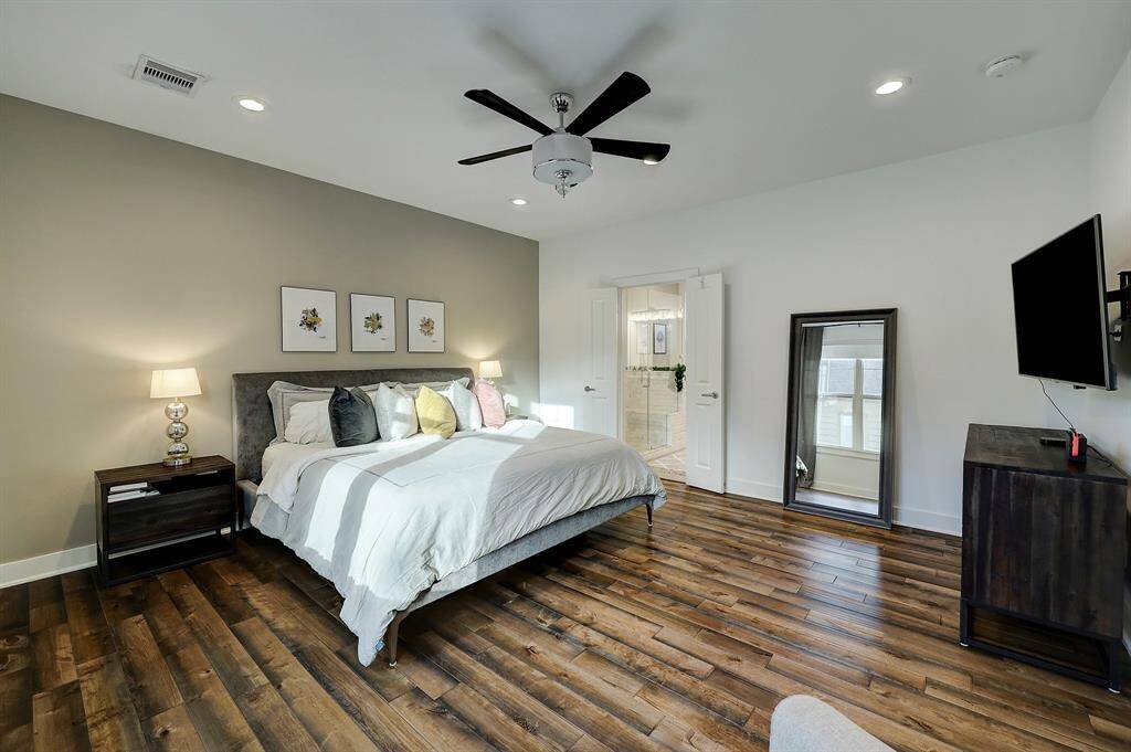 Stretch out in the spacious primary suite, which will easily accommodate larger pieces of furniture. Note the beautiful engineered floors that continue seamlessly from the second level to the third.