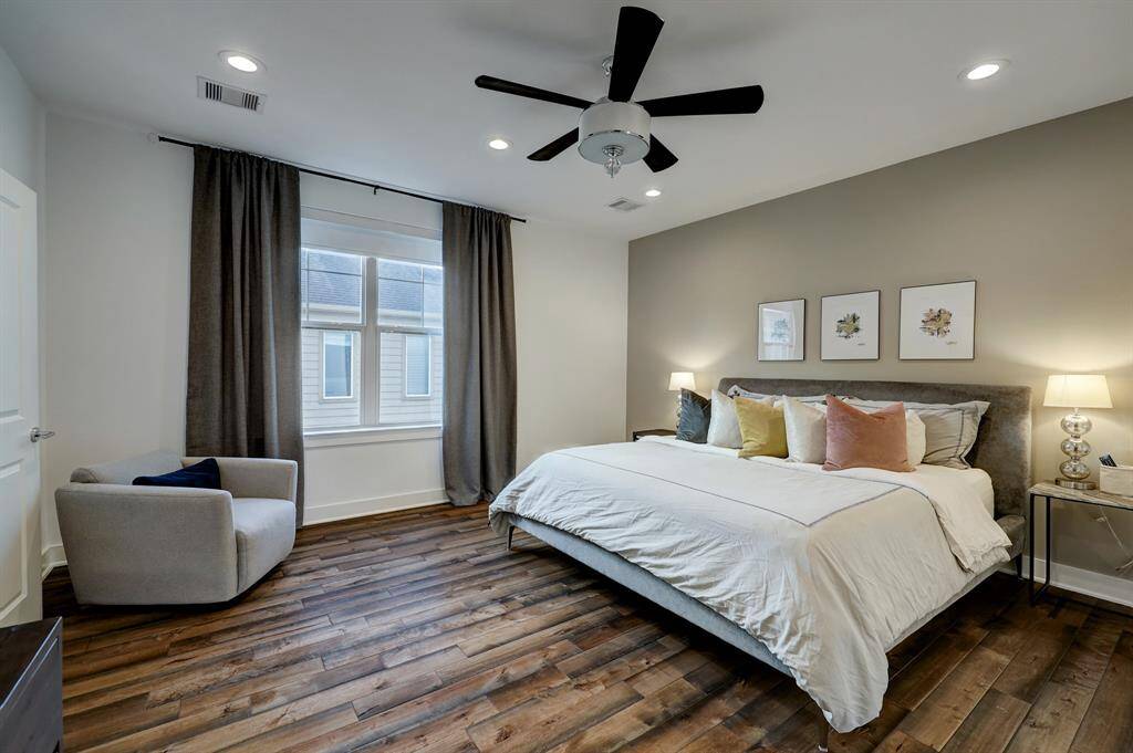 The primary bedroom's double window brings lots of natural light into the room