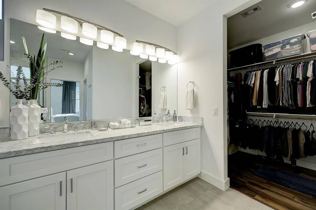 Great walk-in closet located off the primary bathroom - ideal placement to allow your other half to sleep late while you're getting ready in the morning.