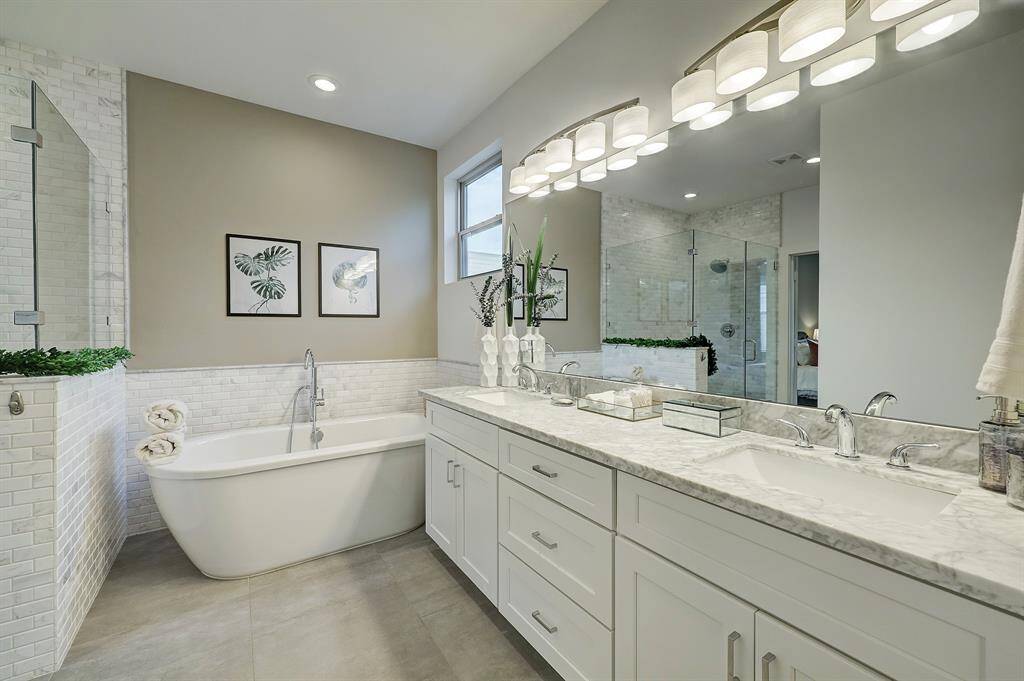Double sinks and great counter space and storage in the primary bathroom.