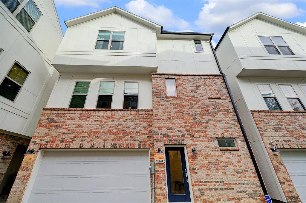 A good combination of brick and cement board exterior with an eye catching navy blue door.
