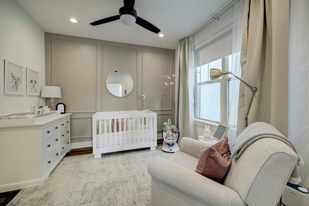 Secondary bedroom located on the third floor. It's wonderful for a nursery (like in this case), kids room, guest bedroom, or an office.