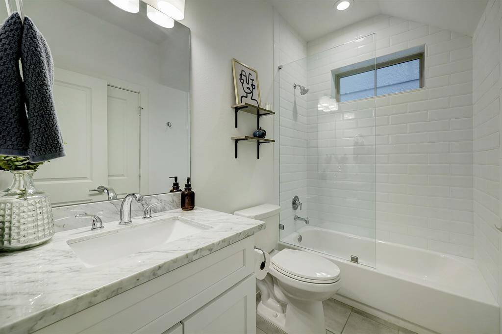First floor room has a full bath and closet. The bathroom includes a tub with a glass panel that helps the room feels bigger