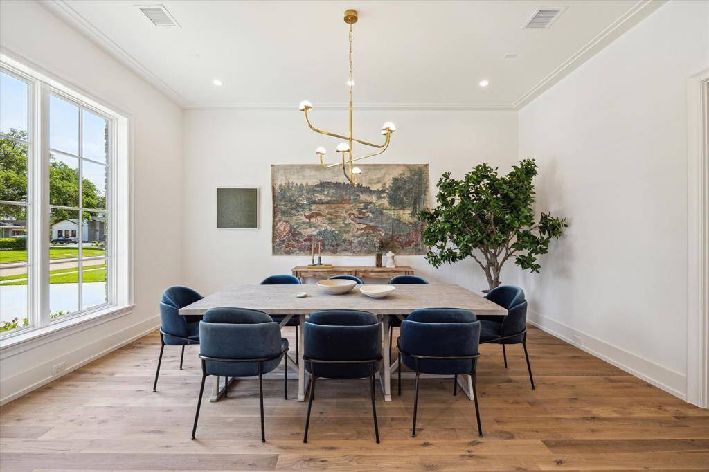Great dining room area with large windows looking over the front yard.