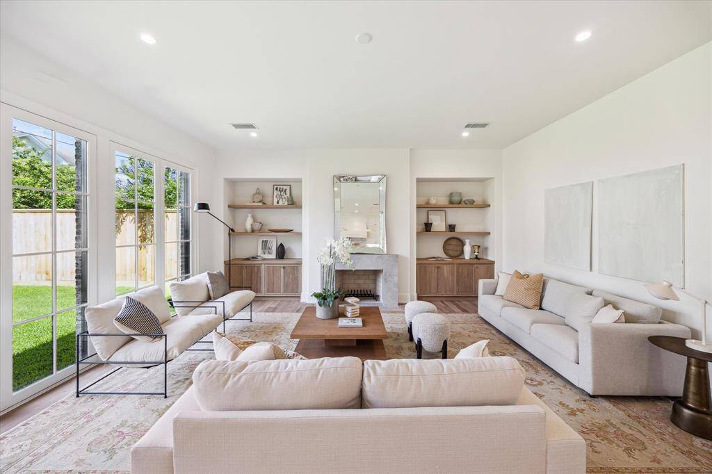 Spacious living room complete with fire place and built-ins. Windows over look the back yard area.