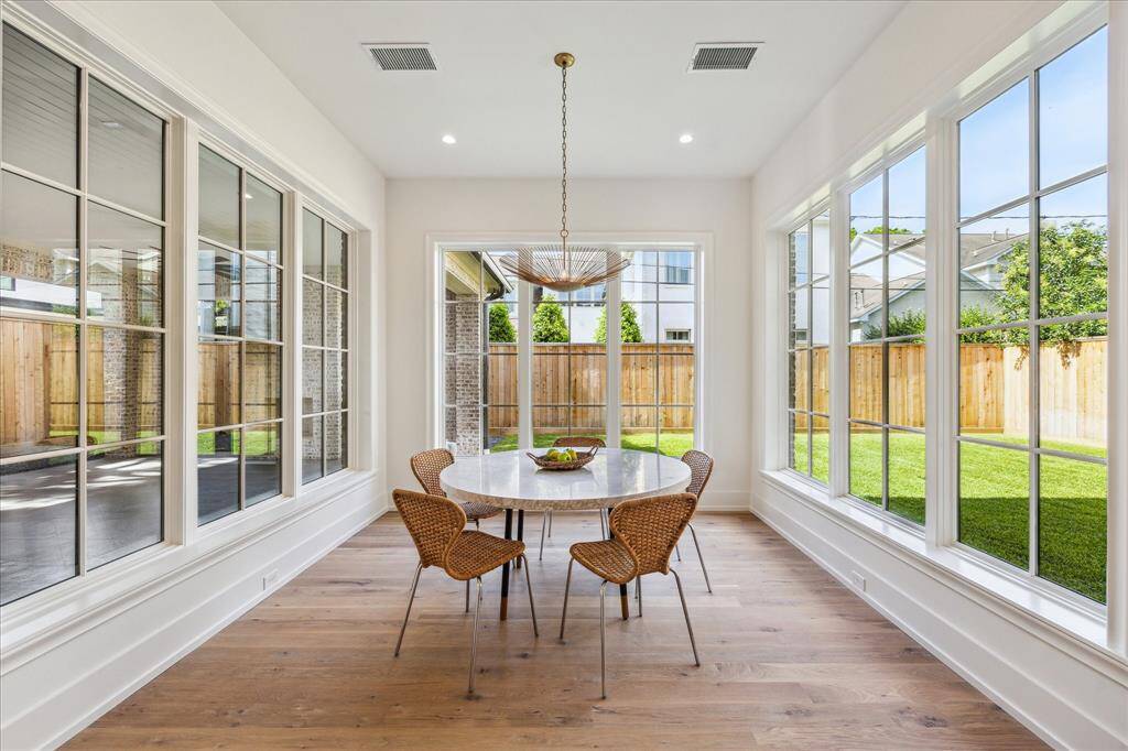 Another view of the living room as it is open to the kitchen and breakfast area.