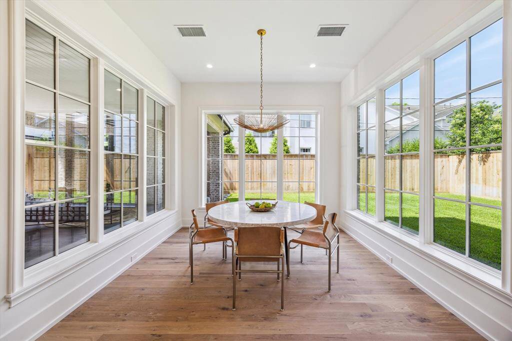 Breakfast room located just off the kitchen has the best lighting with surrounding windows into the backyard.