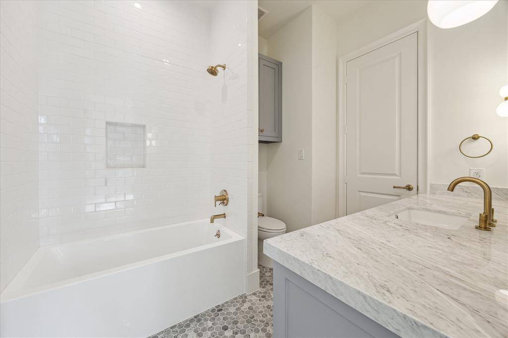 Another view of the primary bathroom vanities.
