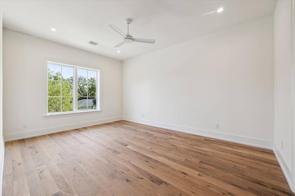 Large game room located on the second level has a wet bar at the entrance.