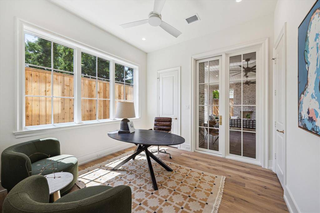 Utility room located upstairs features ample cabinet and counter space as well as 2 washers and 2 dryers.