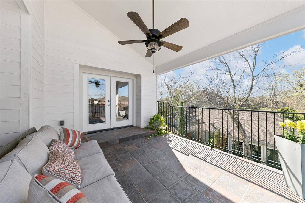 The large covered patio off the game room overlooks the backyard pool and adds to the relaxation and entertaining options upstairs.