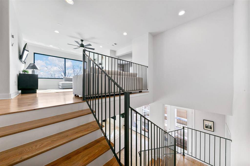 The grand staircase features three landings offering multiple viewpoints to take in the stunning architectural and natural light that convert the abundant wall space into ideal focal points for artwork worthy of the most acclaimed galleries.