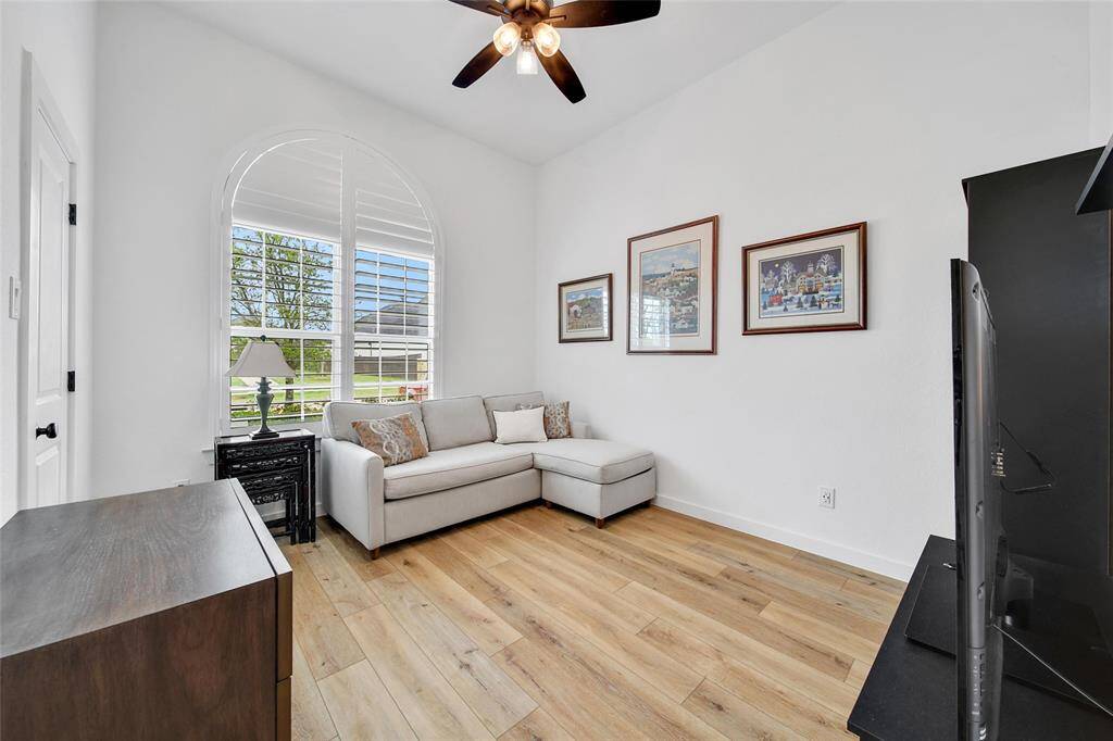 Bedroom 2 (currently being used as a Den) is located towards the front of the home on a private wing. It is accented with beautiful shutters and has a connecting bathroom, ceiling fan and walk in closet.