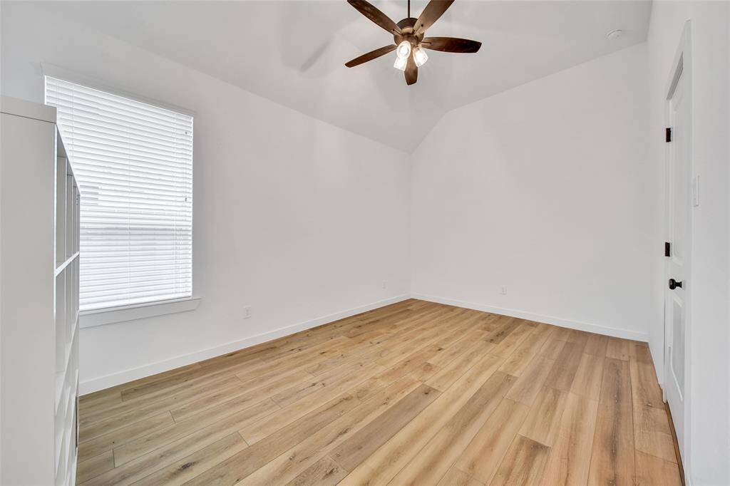 Bedroom 4 offers a ceiling fan & walk in closet.