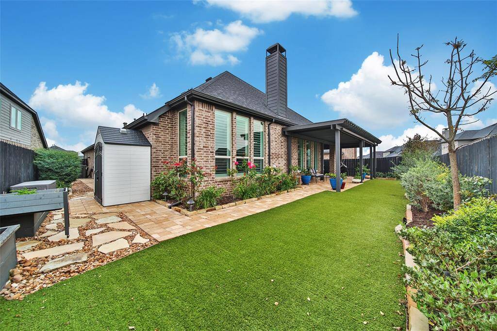 Save time and money in this low mainenance backyard with premium artificial grass turf.