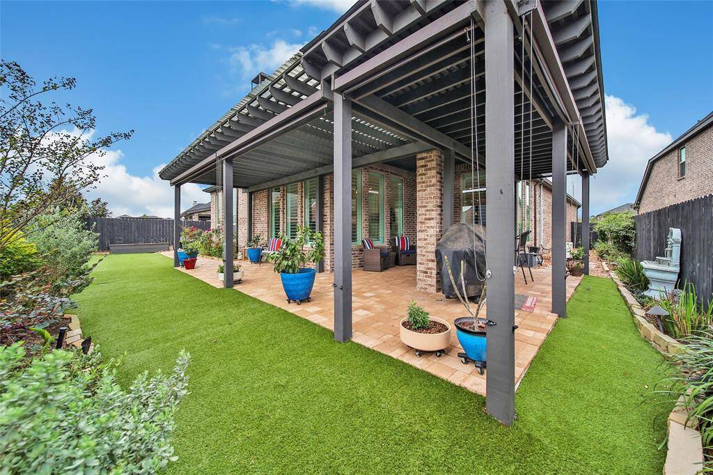 The covered patio provides a perfect spot to start the day with a cup of coffee or unwind and watch the sunset after a long day.