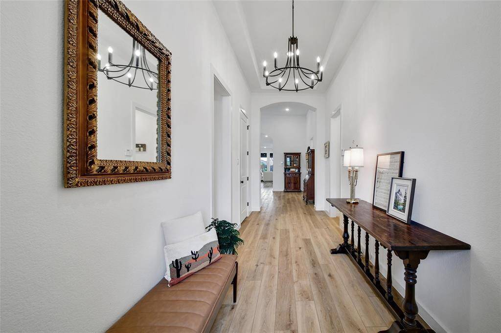 The wide, long entry welcomes you with an open and inviting feel, setting the stage for a spacious and elegant home.