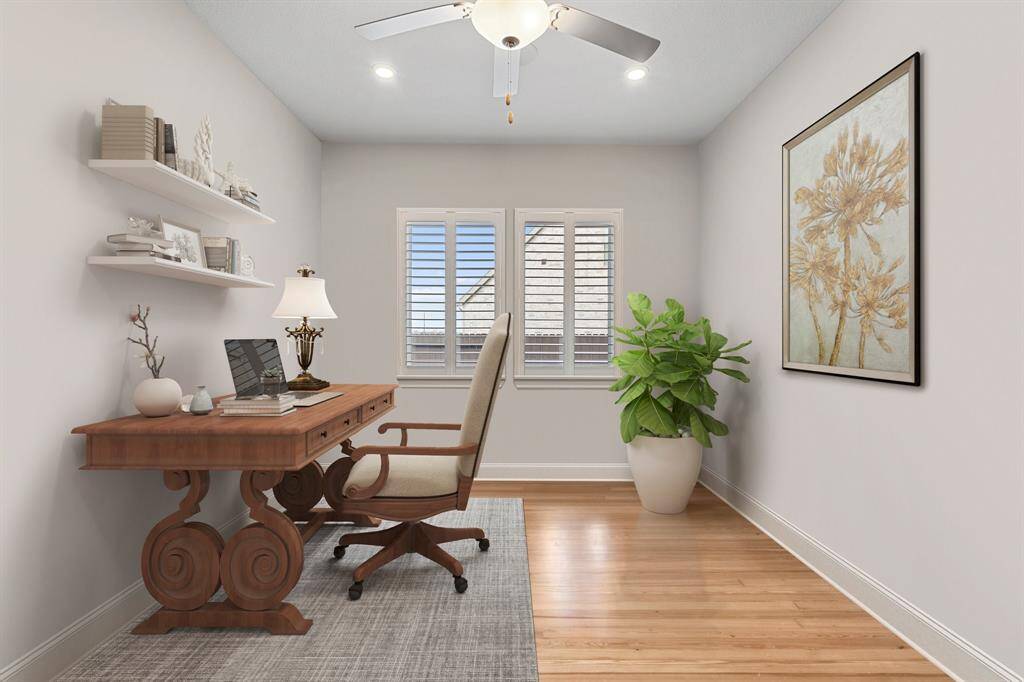 The home office is a perfect blend of functionality and comfort, featuring windows with privacy blinds, a ceiling fan for added comfort, and stylish engineered wood flooring. *Virtually Staged*
