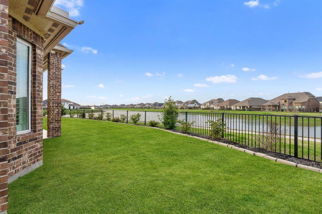 Enjoy breathtaking lake views from the comfort of your covered patio – the perfect spot to relax and unwind while soaking in the serene surroundings.