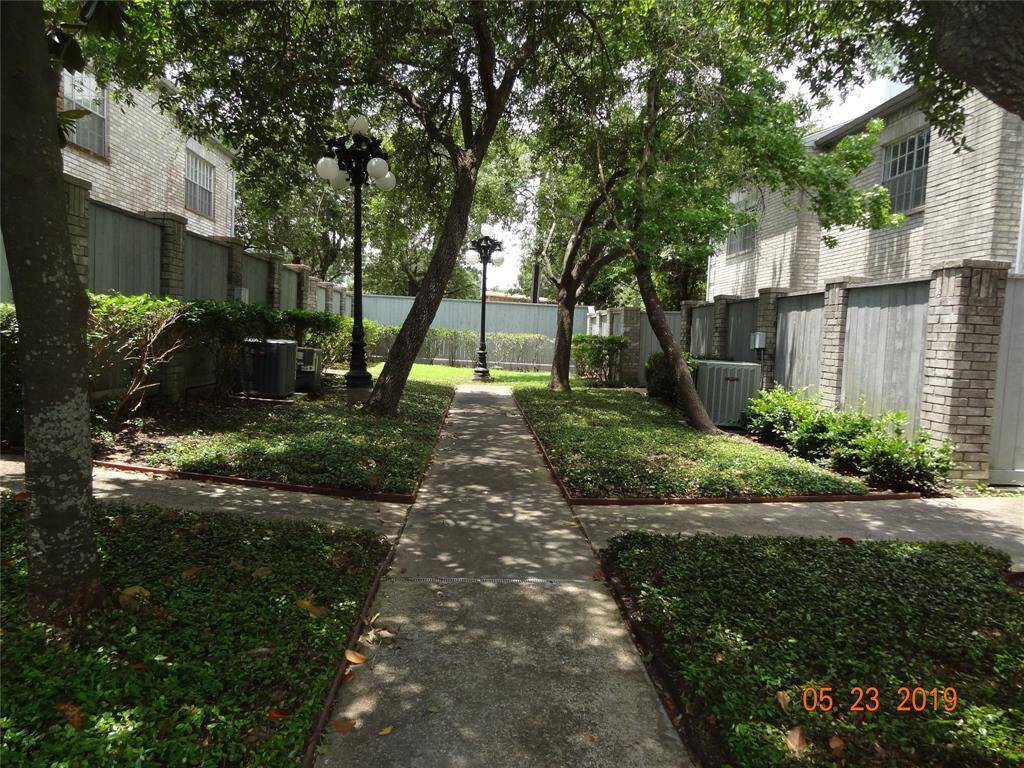 Pretty Tree lined walkway to unit. Unit is the last unit on the right.