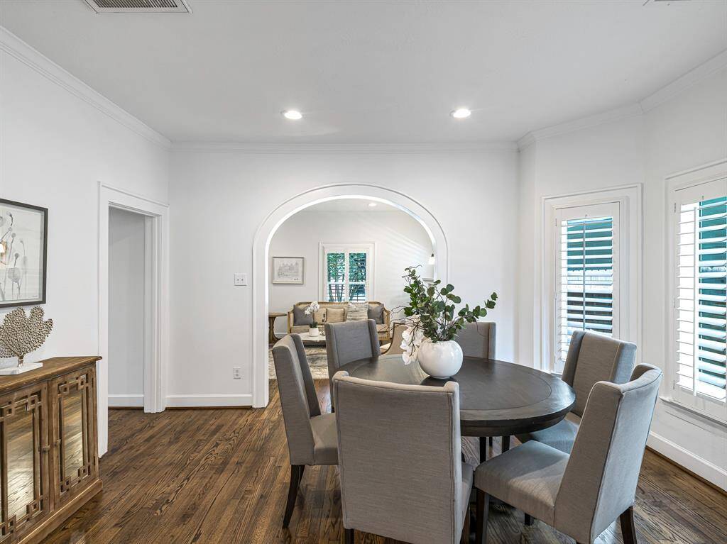 The space easily accommodates a full-size dining set and buffet, while recessed lighting adds a bright, welcoming touch.