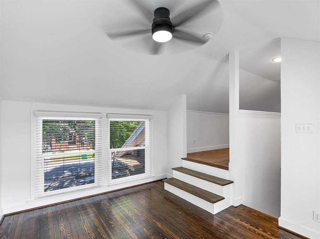 A bonus room is situated above the porte-cochère, offering the perfect space for a study or craft area.