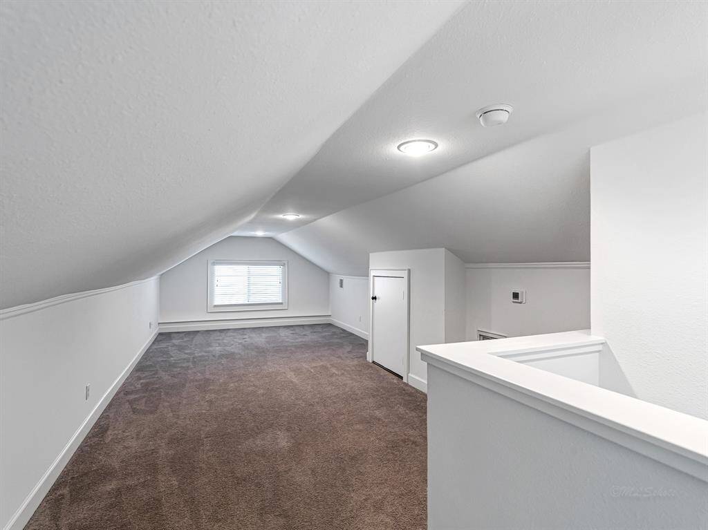 Measuring approximately 11x30 feet, this game room offers ample space for an entertainment center and a large sectional.