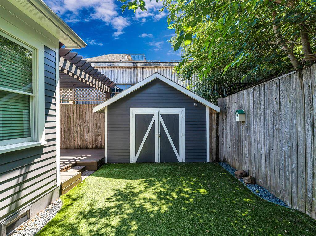 A convenient storage shed is situated at the back of the property, providing ample space for tools, equipment, or seasonal items.