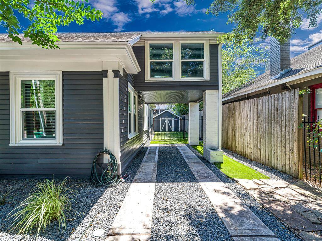 A privacy gate secures the backyard, providing separation from street access and added peace of mind.