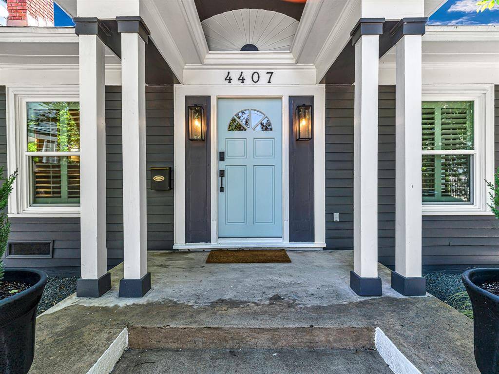 The Craftsman-style covered front porch is adorned with vintage details and custom molding, adding timeless character and curb appeal.