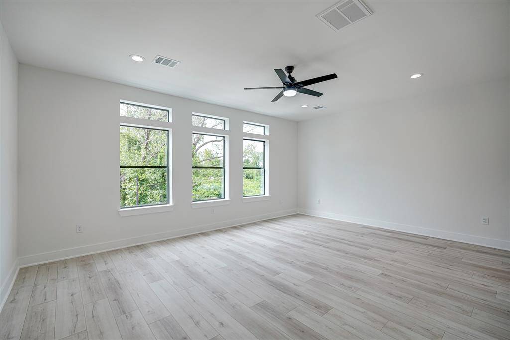 Primary bedroom with lots of natural light