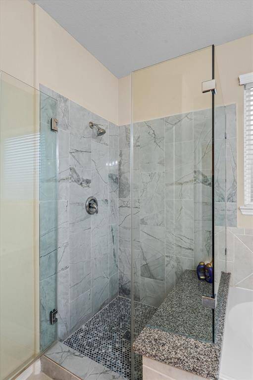 Renovated walk-in shower.