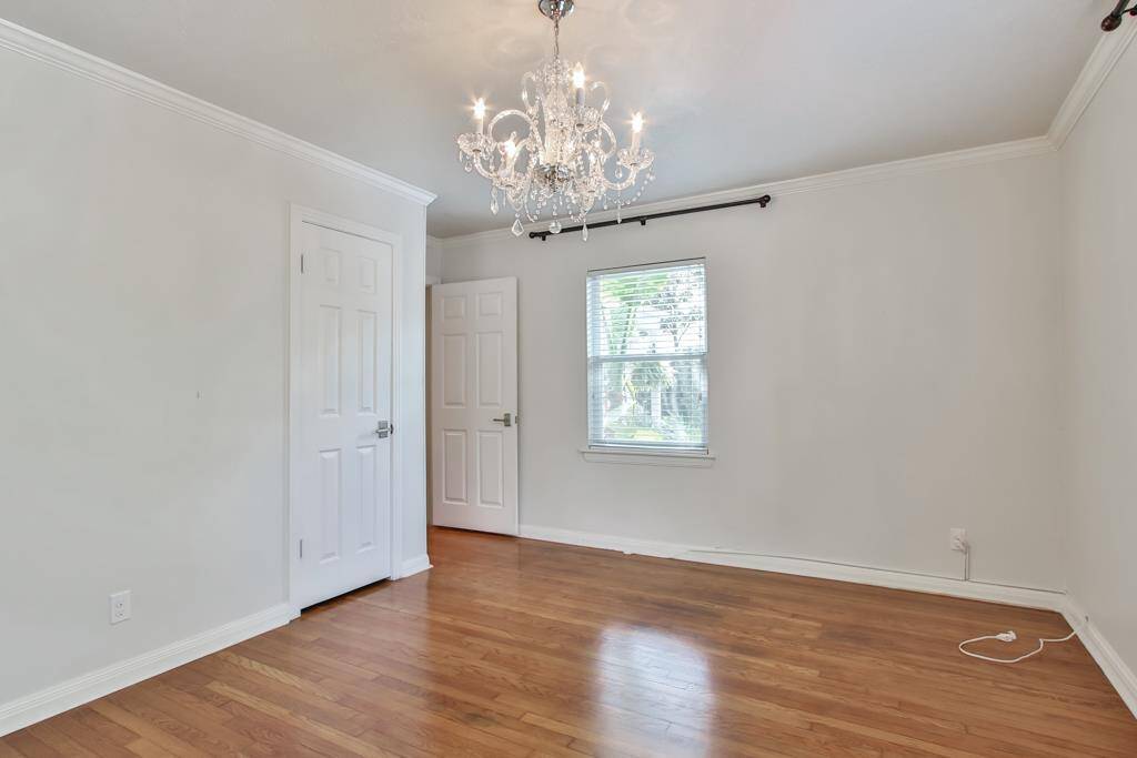 Third bedroom facing the door and closet.