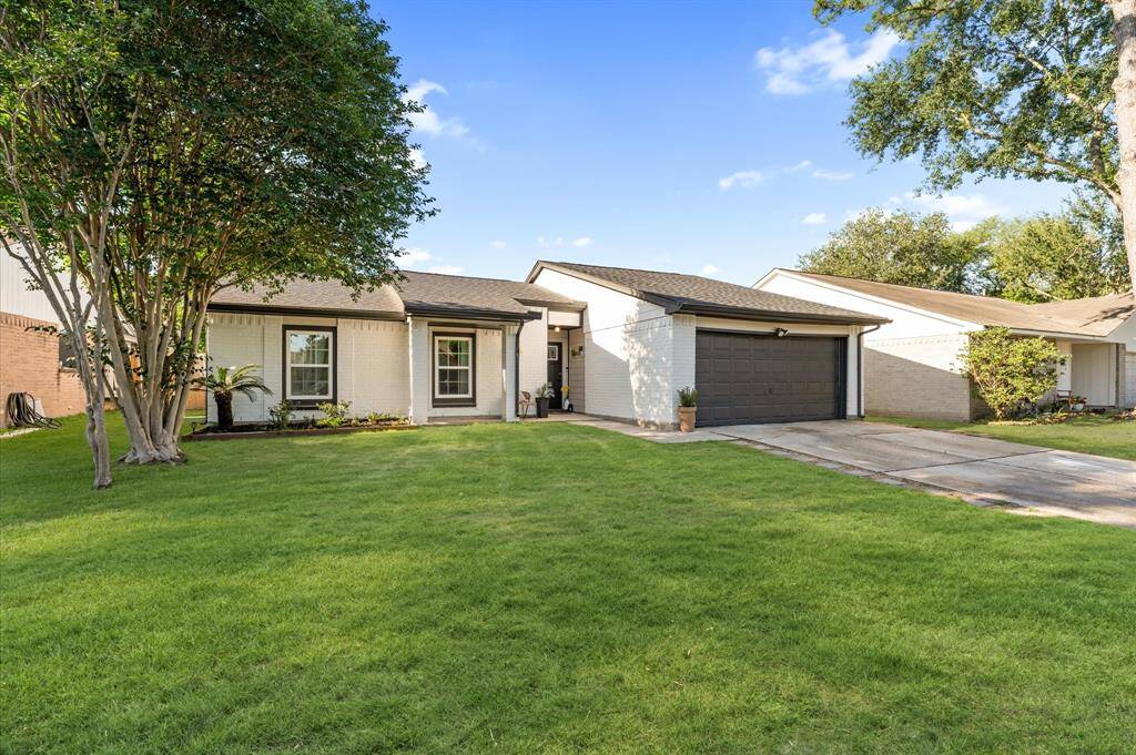 Welcome home! Charming curb appeal with a recently replaced roof and well-maintained exterior.