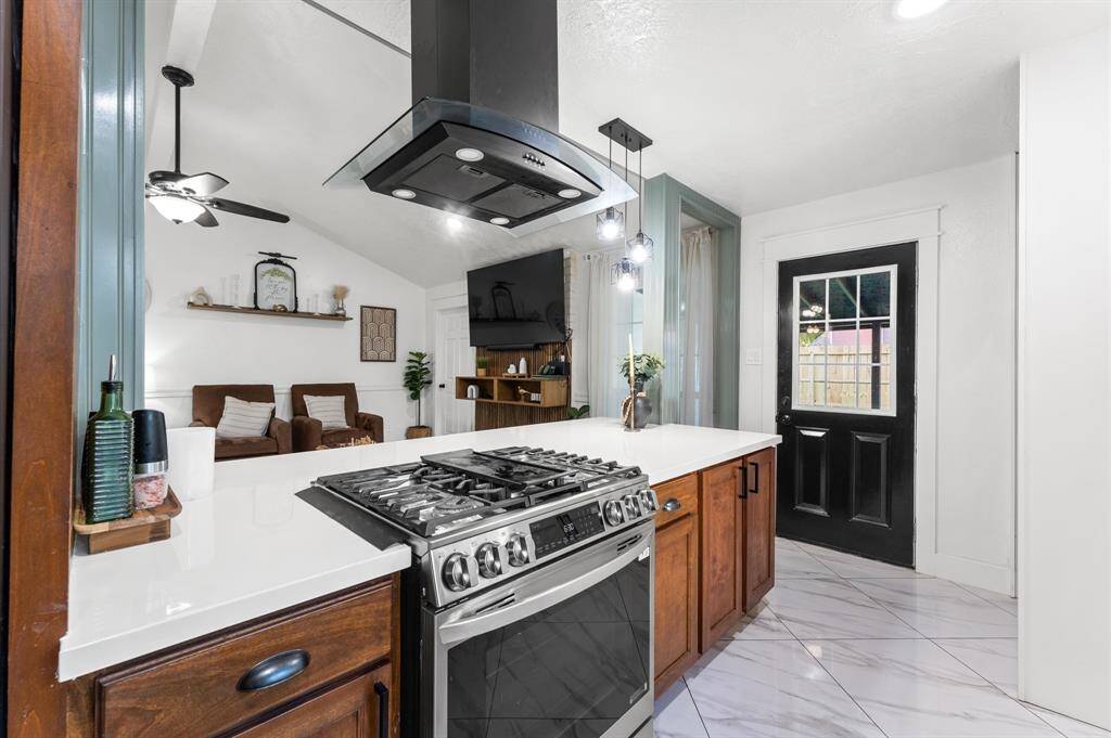 Open kitchen overlooks the living room.