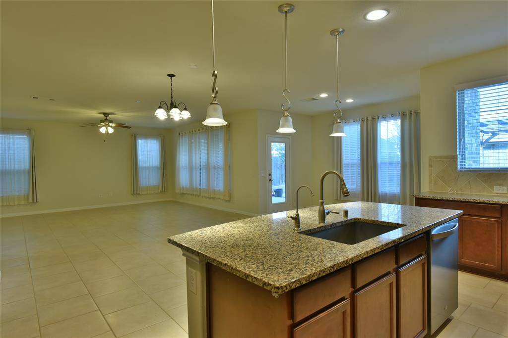 Bright and airy open kitchen layout, flooded with natural light.