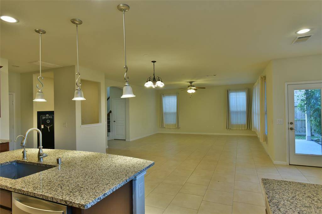 Another angle of the kitchen, dining and living area.