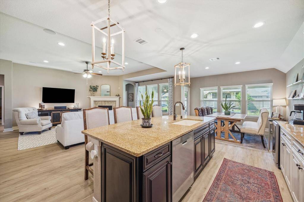 With this open floor plan, the kitchen flows effortlessly into the family room and dining area, perfect for gatherings or enjoying family time
