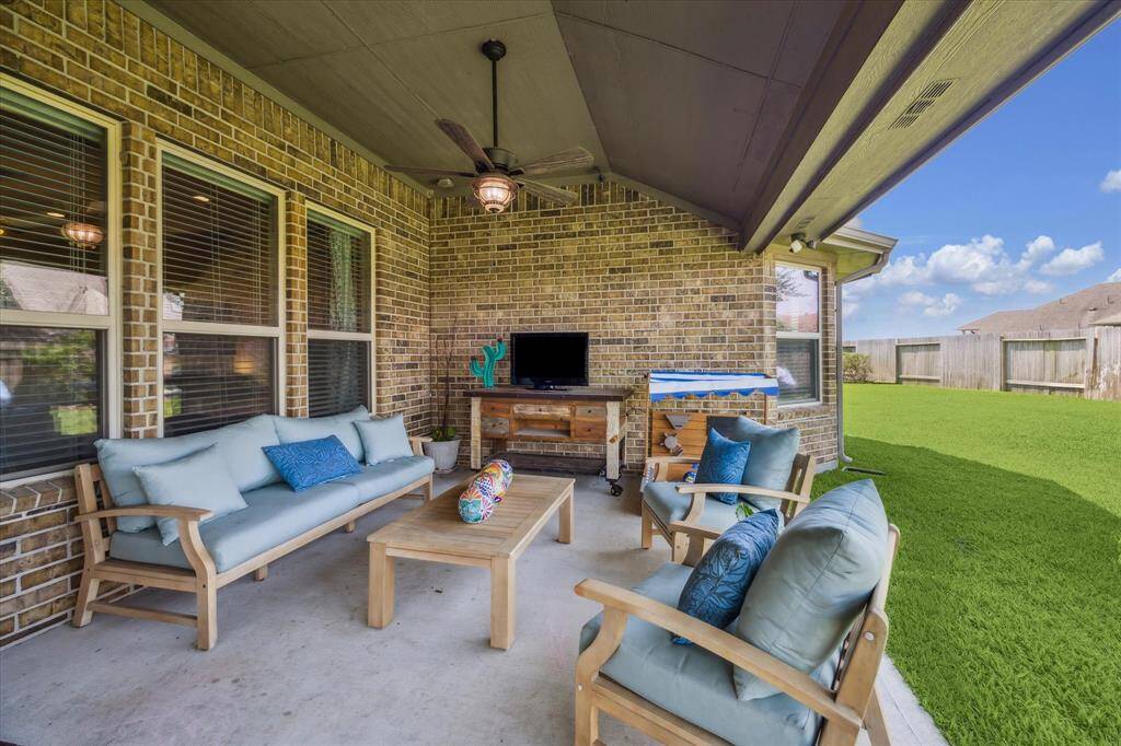 Enjoy outdoor living year-round with this large covered patio