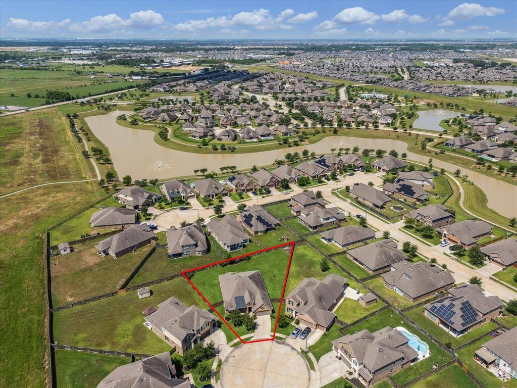 Aerial view of the expansive layout showcasing the large lot size and backyard