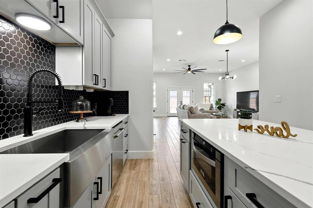 Whether you're hosting or enjoying a quiet meal, this expansive island is both practical workspace and perfect for conversations.
