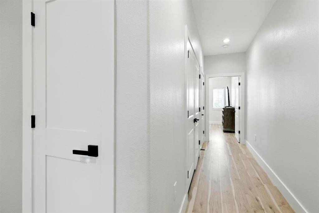 As you make your way up to the open contemporary staircase, you're welcome by a spacious landing.