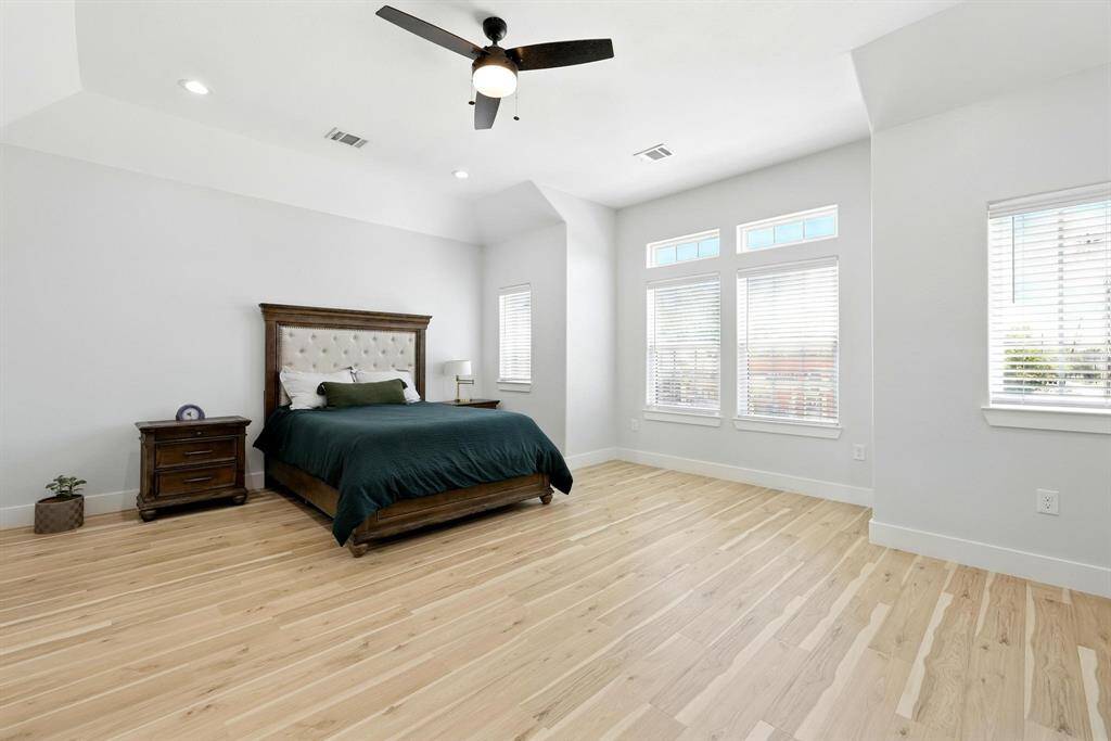 The primary bedroom is a private haven, offering generous space and natural light.
