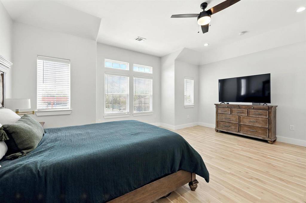Windows invite lots of natural light to fill the bedroom.
