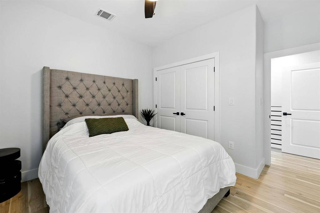 This second bedroom also has large window that invites natural light to fill.
